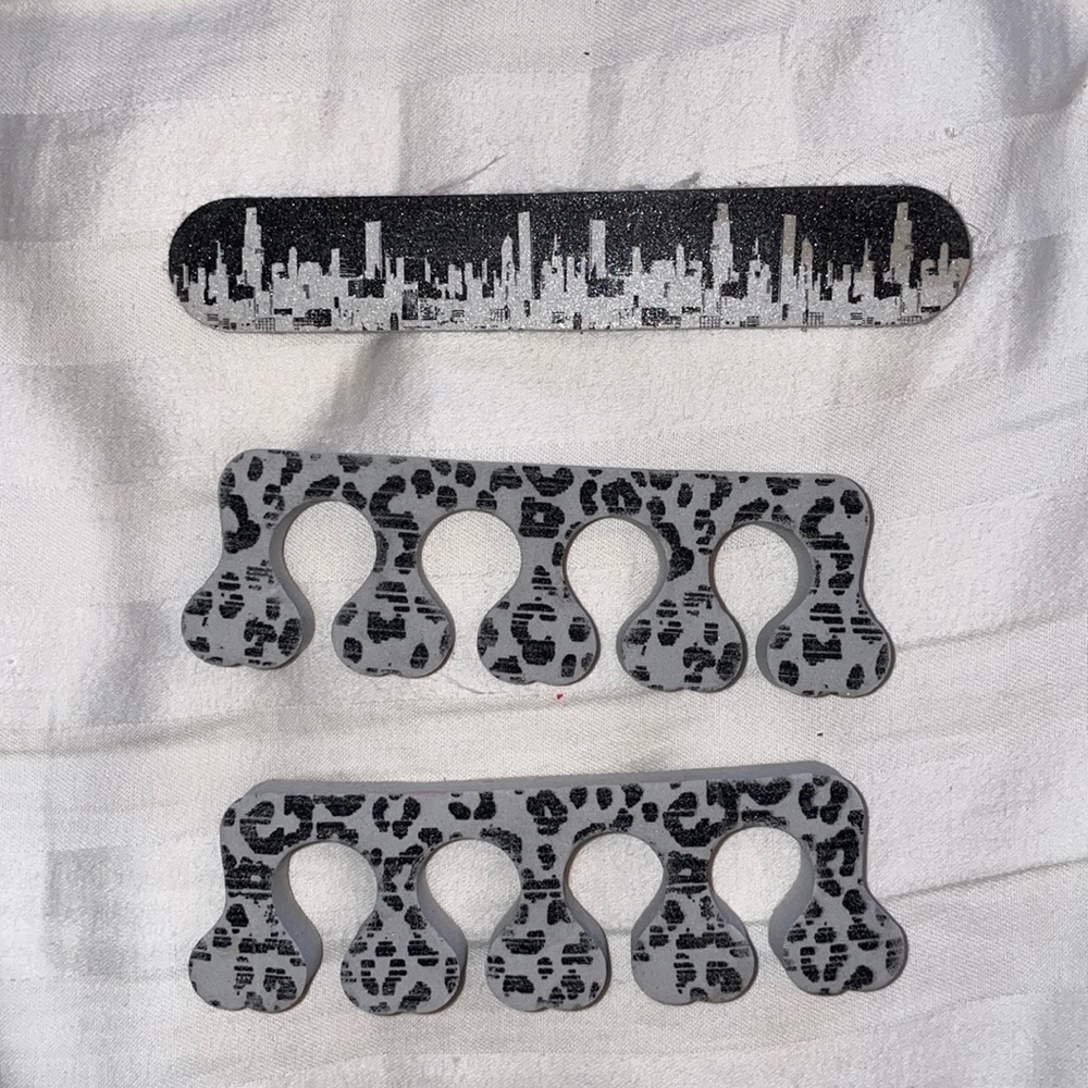 Nail file toe separation manicure pedicure mani pedi NYC New York City skyline